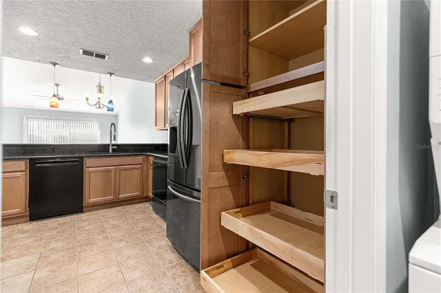 a kitchen with a sink stove and refrigerator