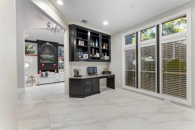 a view of living room kitchen with stainless steel appliances granite countertop cabinets and window