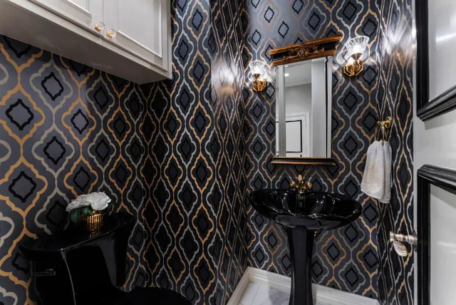 a spacious bedroom with a large bed and a chandelier