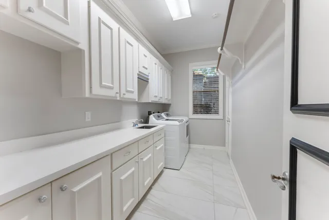 a bathroom with a double vanity sink mirror double and shower