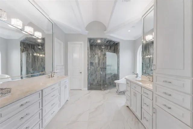 a spacious bathroom with a double vanity sink mirror and double