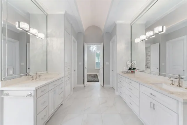 a bathroom with a sink double vanity and a mirror
