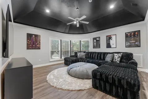 a bedroom with a bed and a mirror