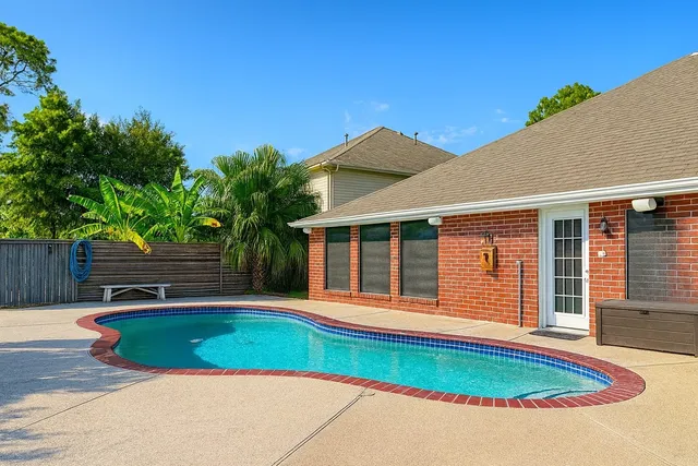 a view of a house with a swimming pool