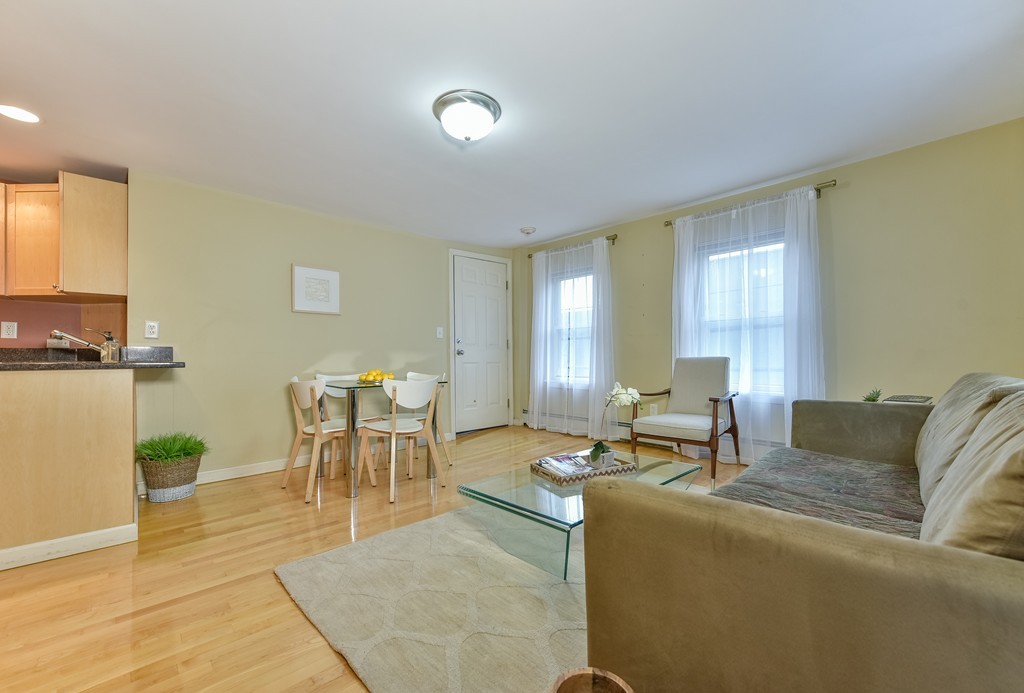 95 Second Street, Unit 3 Cambridge, MA 02141 - Photo 8 of 13 a living room with furniture and a table