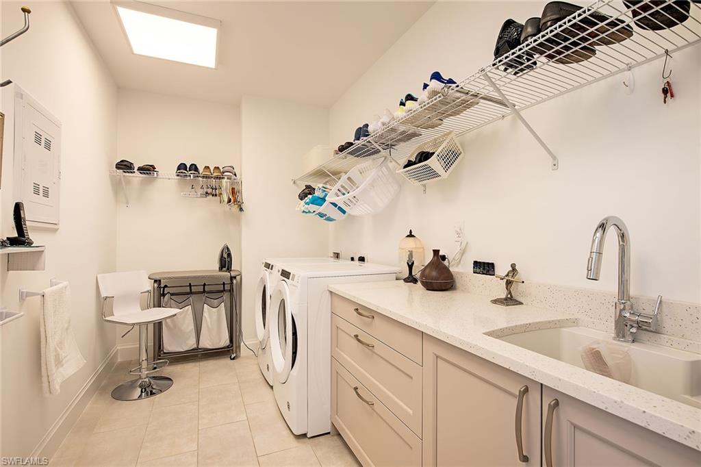 1111 Central Avenue, Unit 207 Naples, FL 34102 - Photo 12 of 18 a bathroom with a sink and a mirror