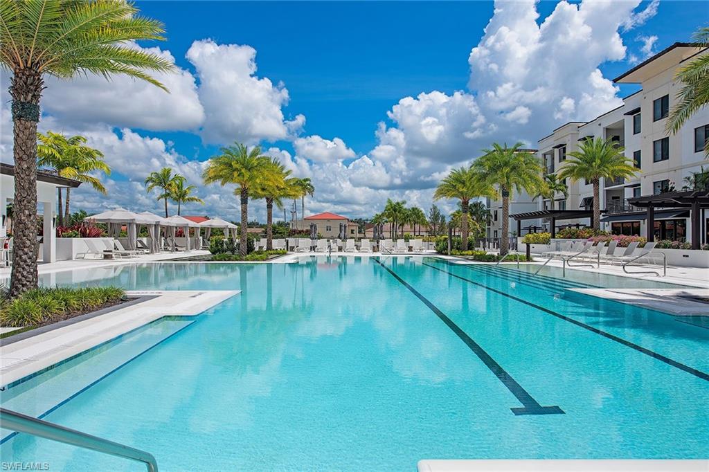 1111 Central Avenue, Unit 207 Naples, FL 34102 - Photo 13 of 18 a view of swimming pool with outdoor seating