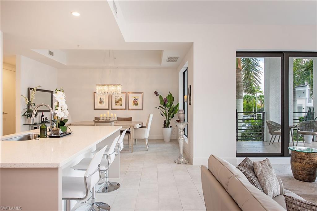 1111 Central Avenue, Unit 207 Naples, FL 34102 - Photo 3 of 18 a view of a dining room with furniture window and outside view