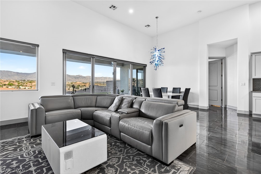 1460 Blue Ridge Trail Mesquite, NV 89027 - Photo 10 of 39 A spacious, naturally illuminated great room with soaring ceilings and scenic desert views.