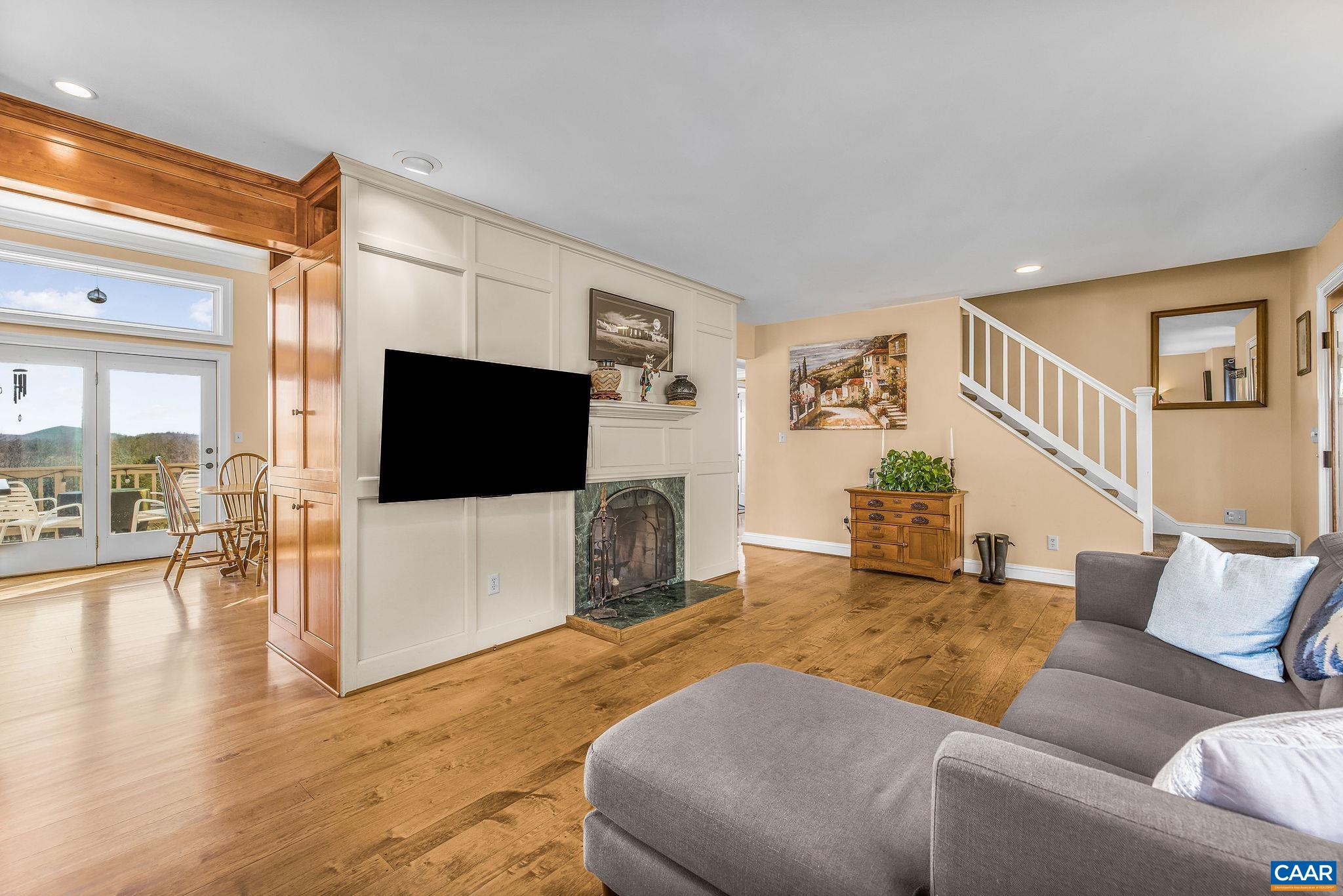 987 Rodes Farm Drive Nellysford, VA 22958 - Photo 11 of 74 a living room with furniture and a flat screen tv