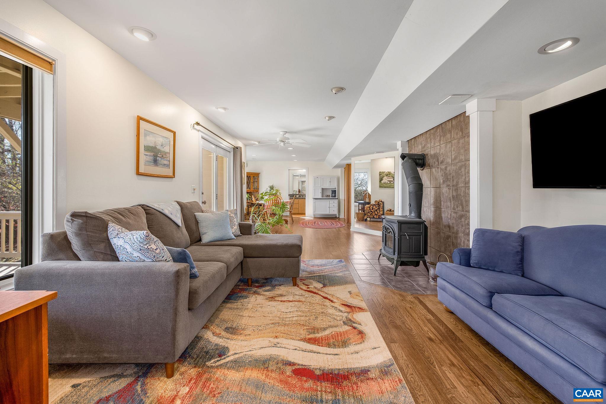 987 Rodes Farm Drive Nellysford, VA 22958 - Photo 37 of 74 a living room with furniture and a flat screen tv