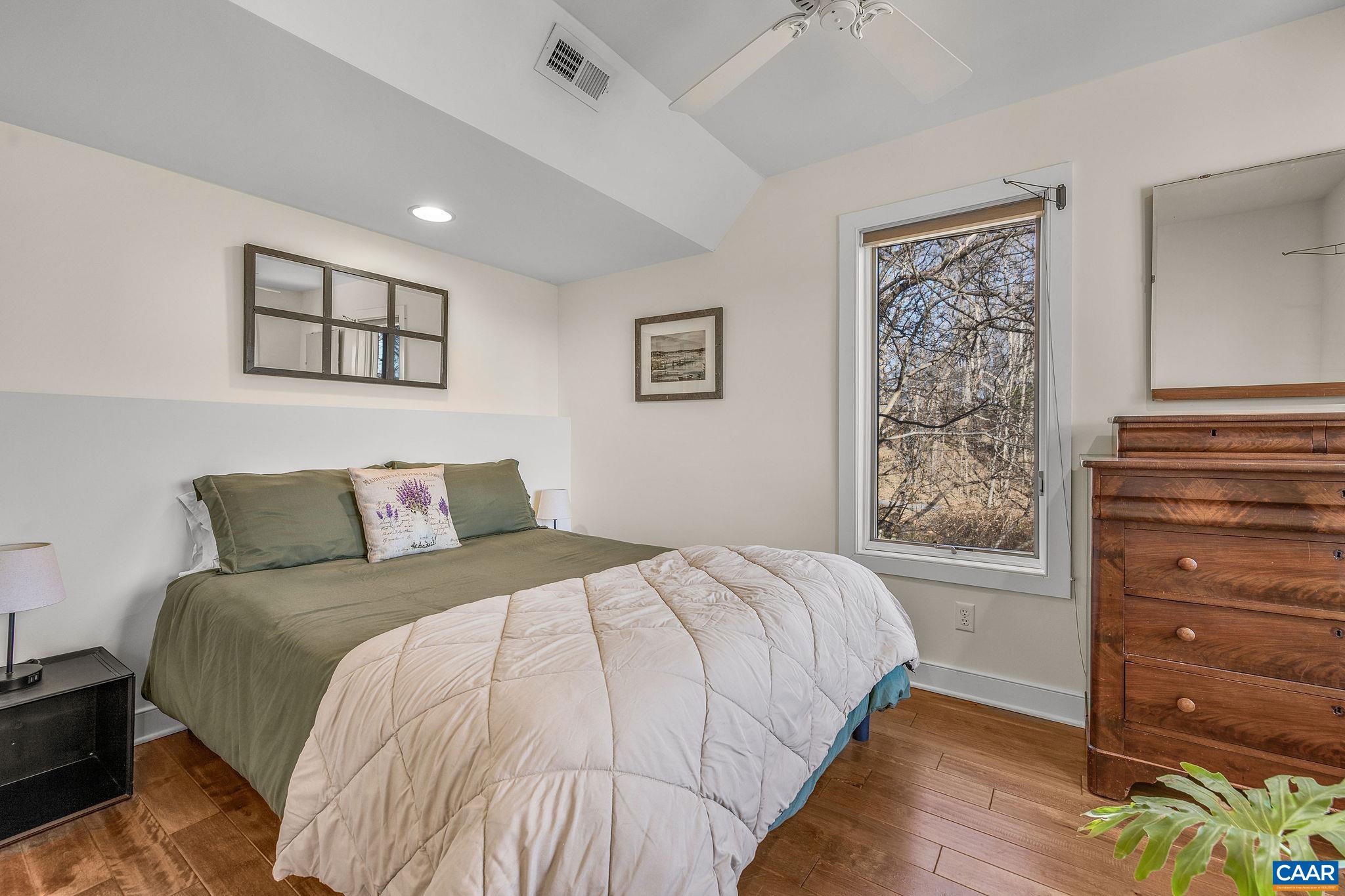 987 Rodes Farm Drive Nellysford, VA 22958 - Photo 43 of 74 a bedroom with a bed and a window