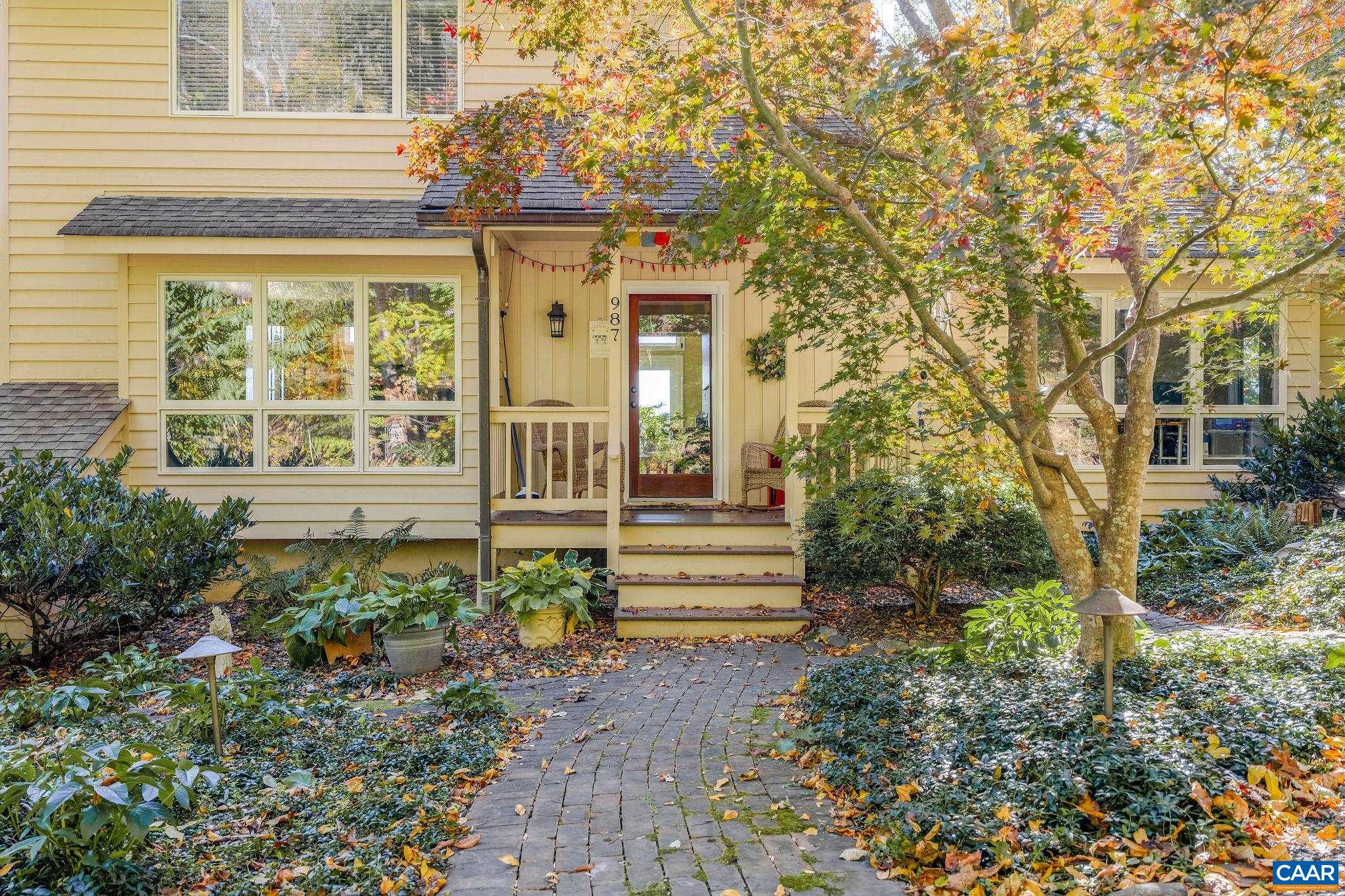 987 Rodes Farm Drive Nellysford, VA 22958 - Photo 61 of 74 a front view of a house with a garden