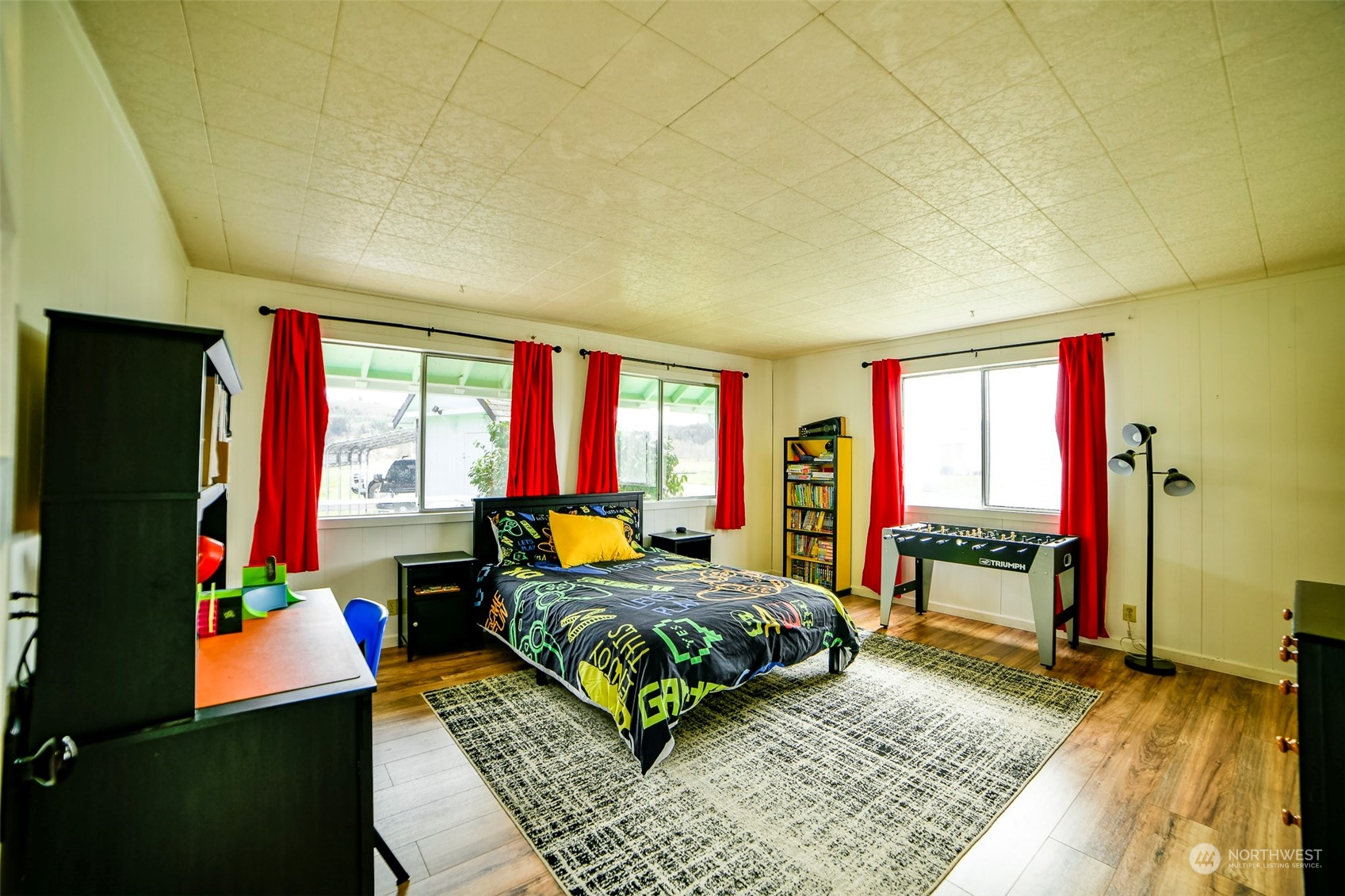 127 Beam Road Chehalis, WA 98532 - Photo 24 of 40 a bedroom with a bed window and a flat screen television