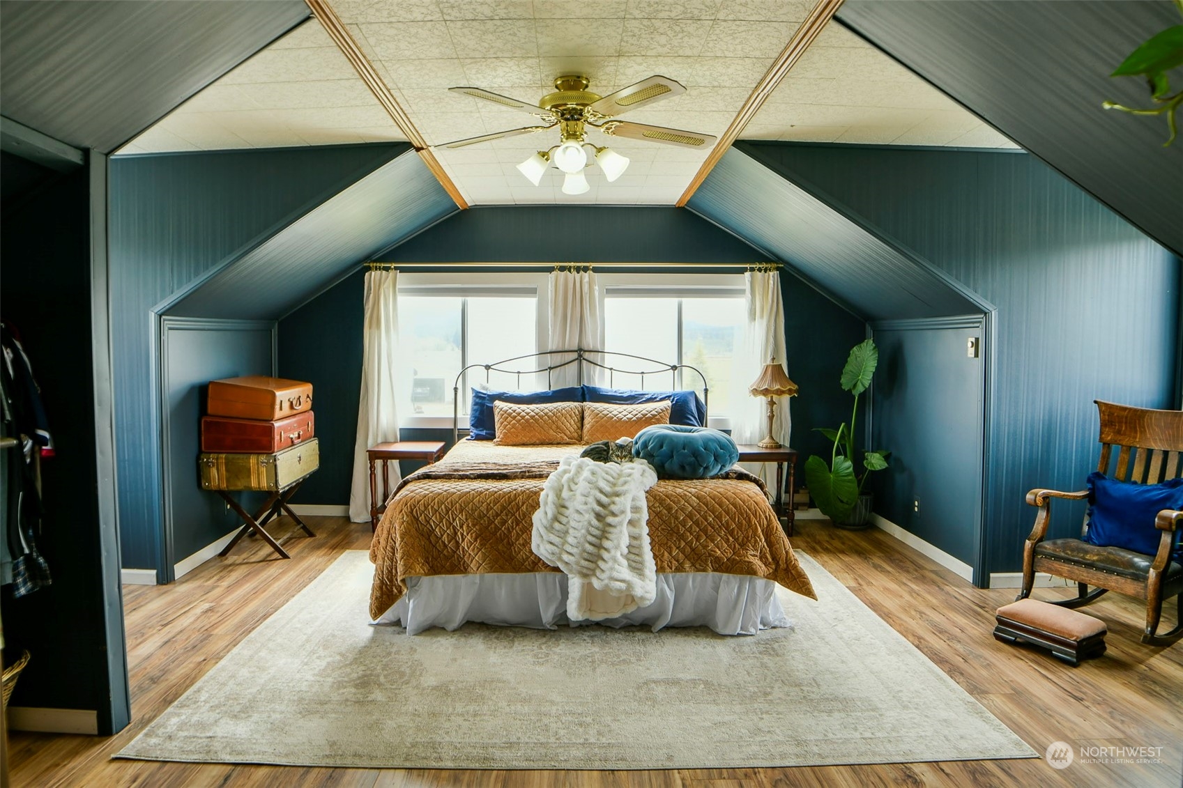 127 Beam Road Chehalis, WA 98532 - Photo 34 of 40 a bed room with a bed and a chandelier