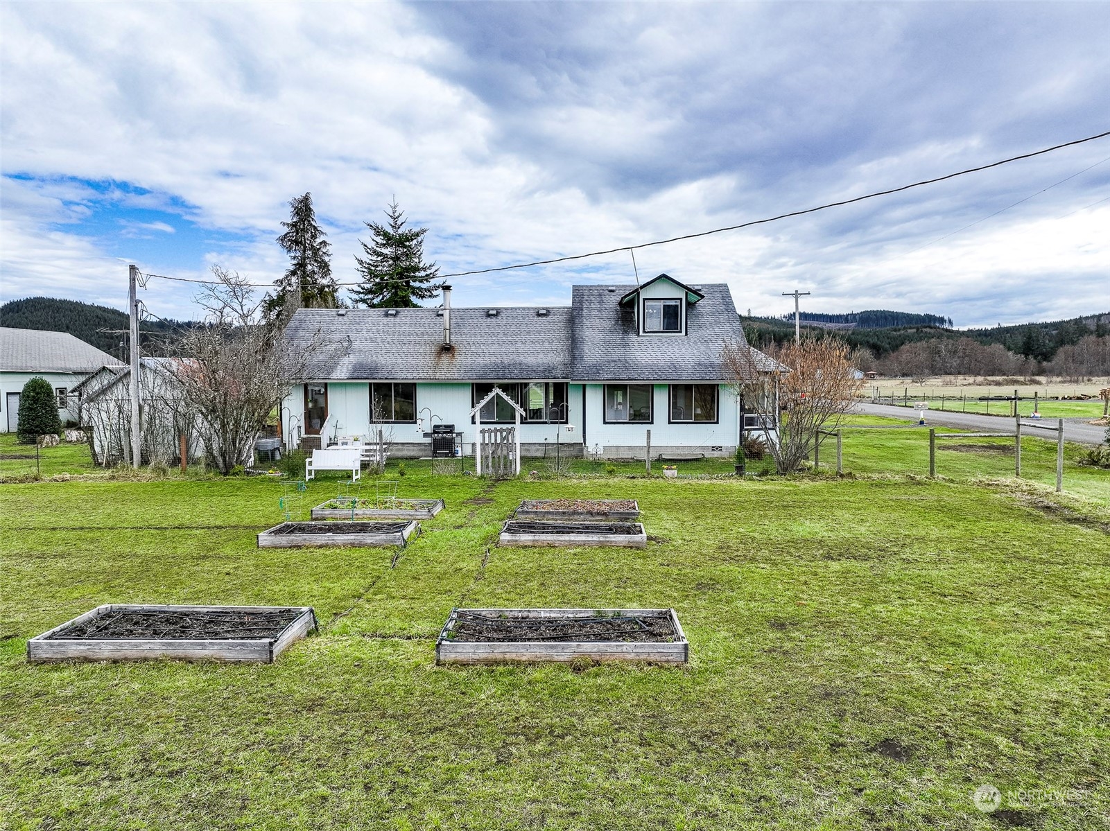 127 Beam Road Chehalis, WA 98532 - Photo 6 of 40 a front view of a house with a yard table and chairs