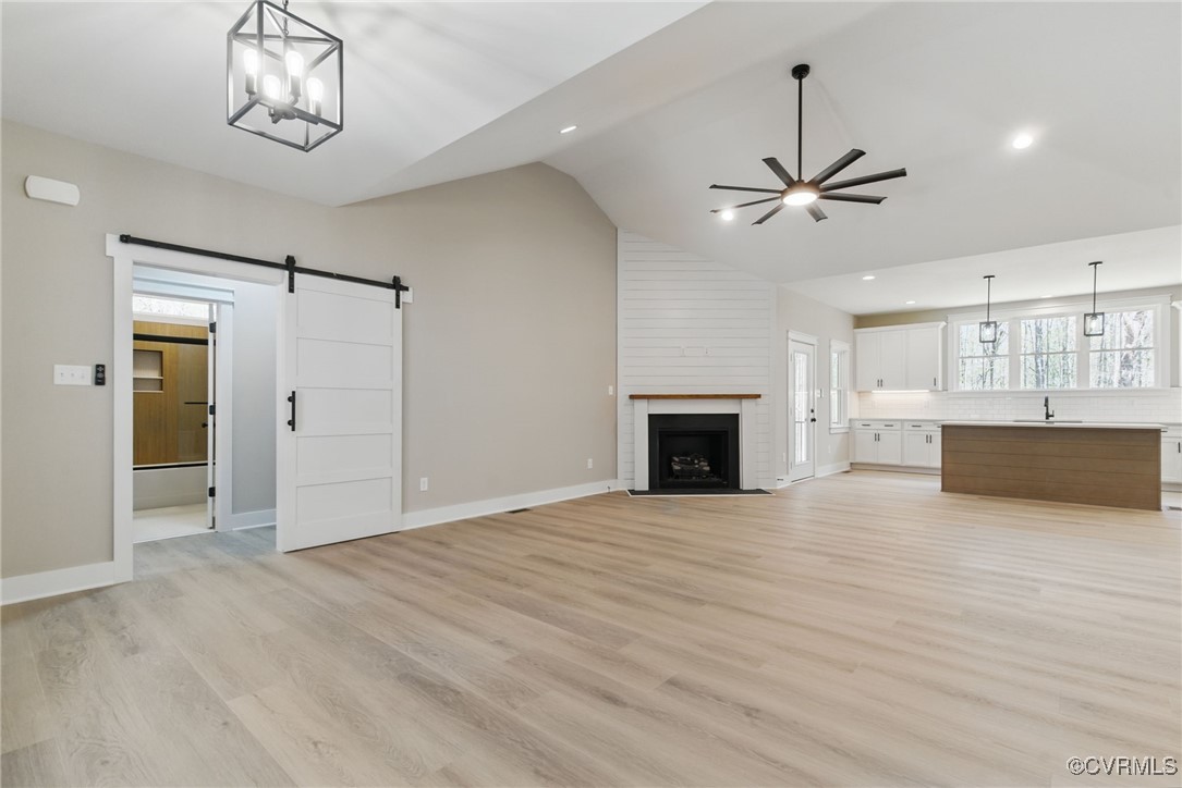 86 Promise Lane Bumpass, VA 23024 - Photo 12 of 46 a view of an empty room with wooden floor and a kitchen