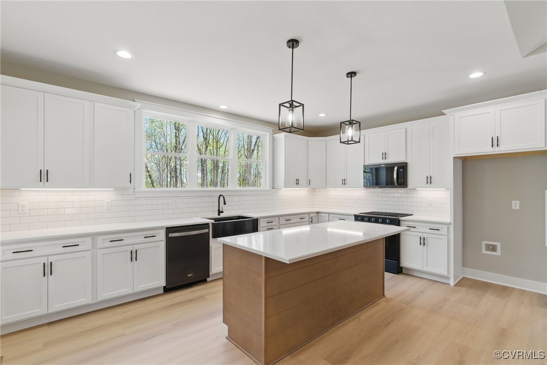 86 Promise Lane Bumpass, VA 23024 - Photo 15 of 46 a kitchen with stainless steel appliances granite countertop a sink stove and refrigerator