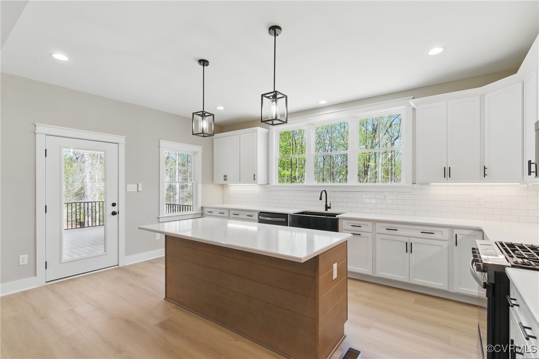 86 Promise Lane Bumpass, VA 23024 - Photo 16 of 46 a kitchen with a sink stove and cabinets