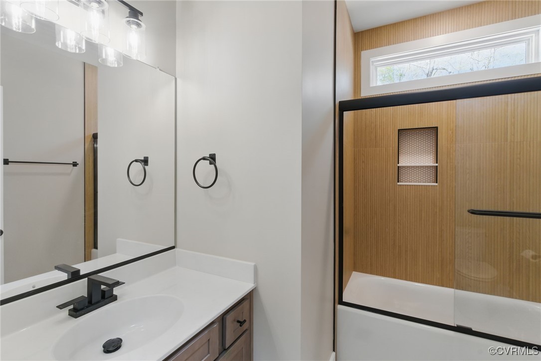 86 Promise Lane Bumpass, VA 23024 - Photo 27 of 46 a bathroom with a sink a mirror a vanity and shower