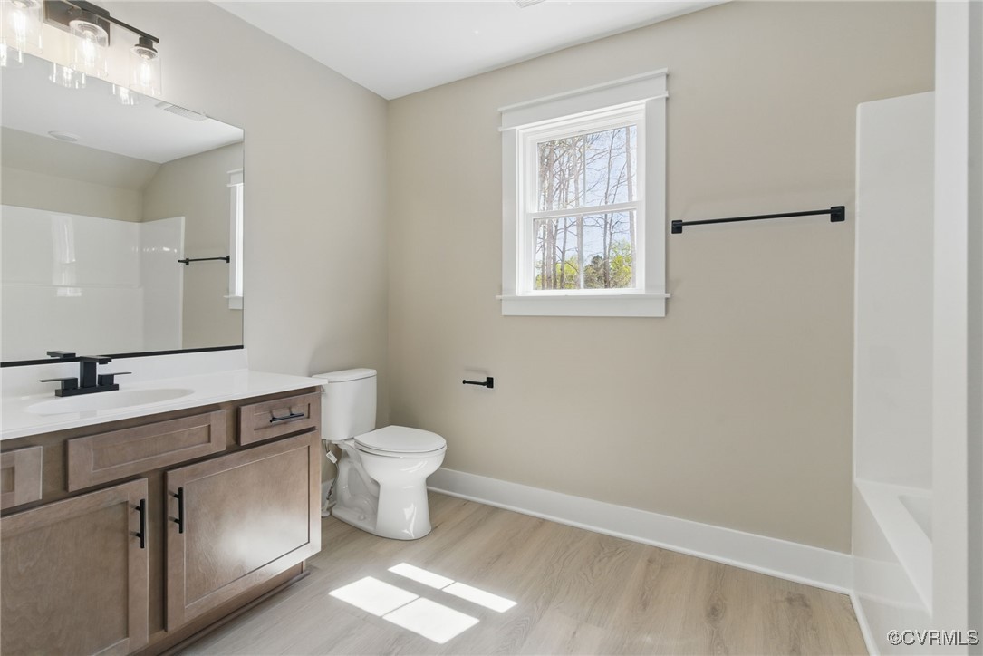 86 Promise Lane Bumpass, VA 23024 - Photo 35 of 46 a bathroom with a toilet sink and mirror