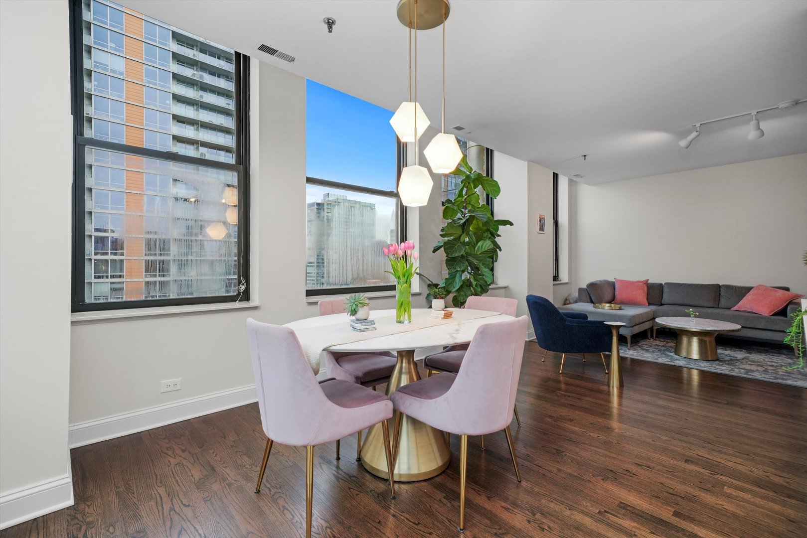 780 South Federal Street, Unit 1207 Chicago, IL 60605 - Photo 11 of 22 a view of a dining room with furniture window and wooden floor