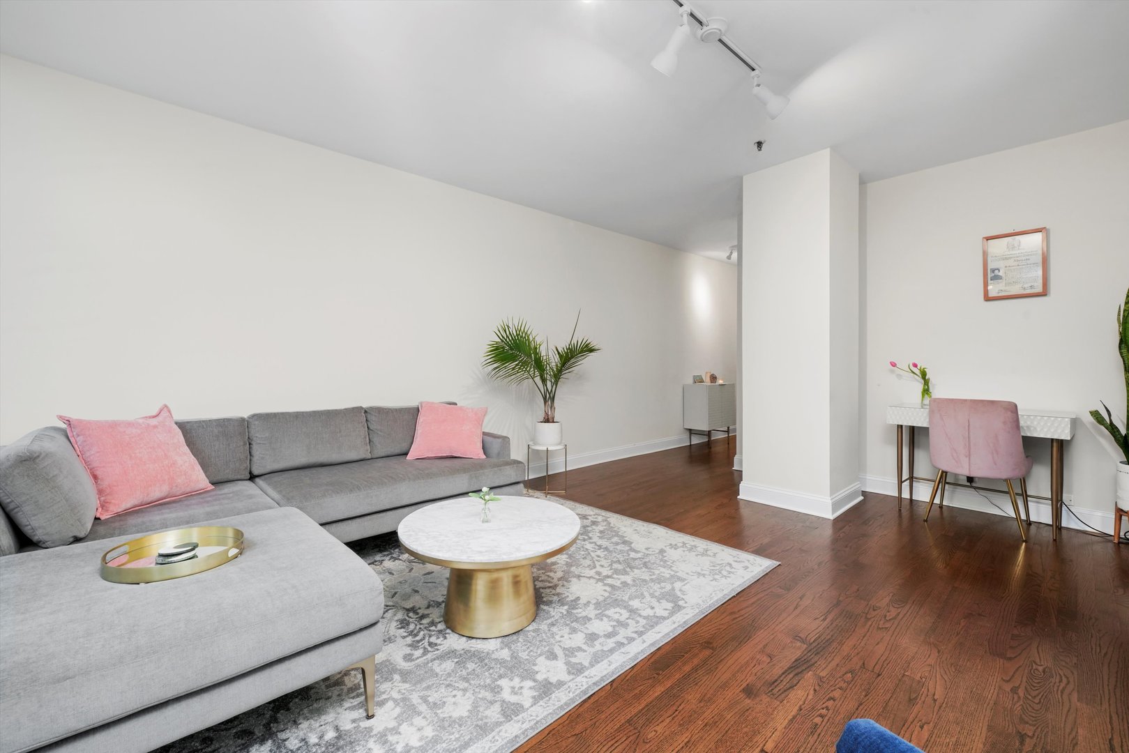 780 South Federal Street, Unit 1207 Chicago, IL 60605 - Photo 7 of 22 a living room with furniture and wooden floor