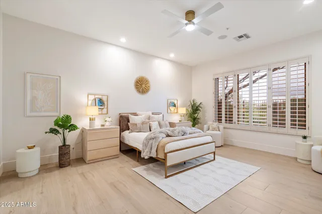 a bedroom with a bed and a cabinets