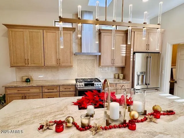 a kitchen with a sink a counter top space stainless steel appliances and cabinets