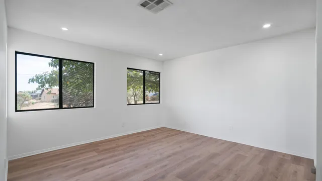 a utility room with cabinets washer and dryer