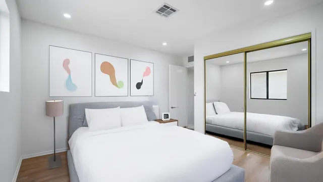 a view of a yard with wooden fence