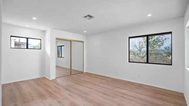 a view of empty room with wooden ceiling