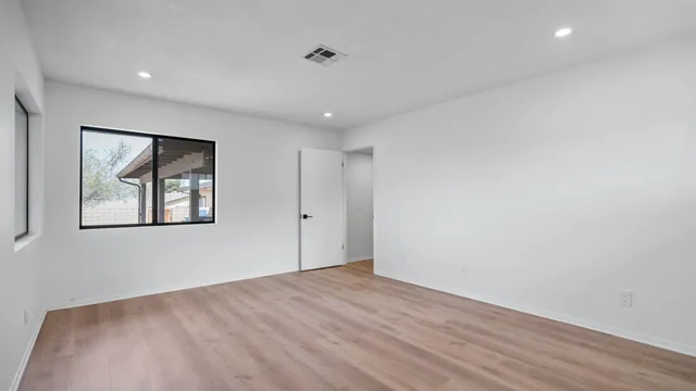 a view of an empty room with a staircase