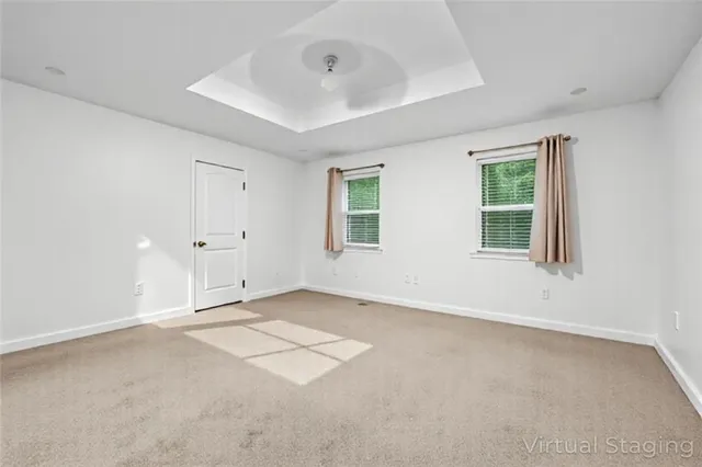 a wooden bench sitting in the middle of a yard