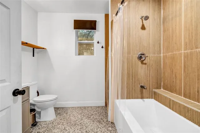 a view of a workspace with furniture and wooden floor