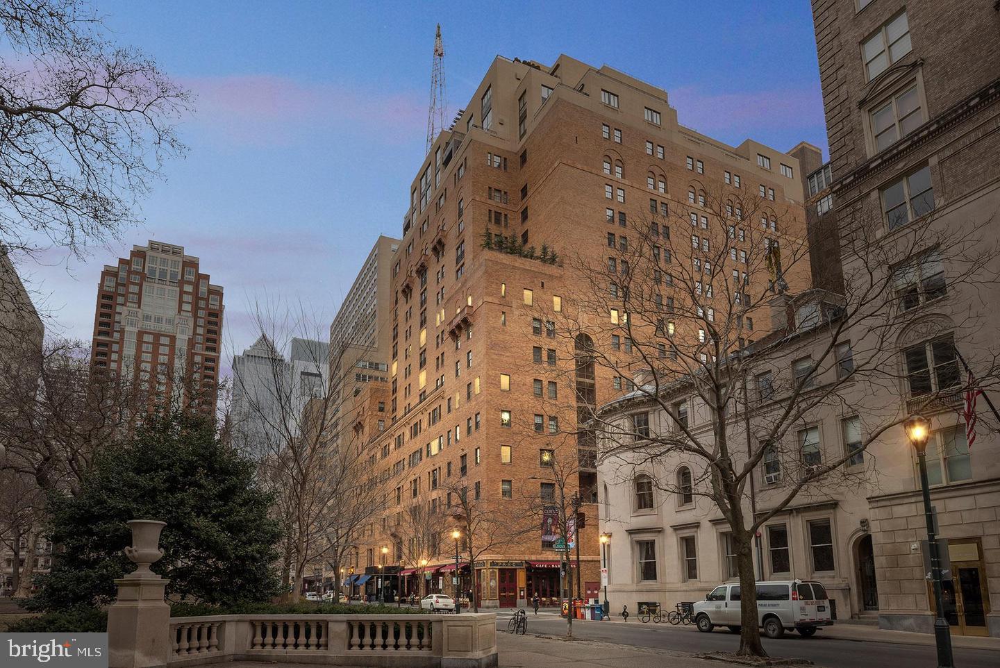 a view of a building and trees