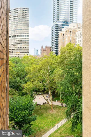 a view of a large building with a yard