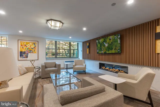 a large kitchen with a table and chairs