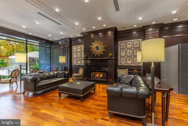 a living room with furniture fireplace and a flat screen tv