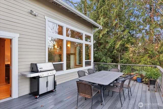 a balcony with furniture and wooden floor