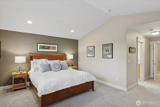 a bedroom with a bed and a lamp