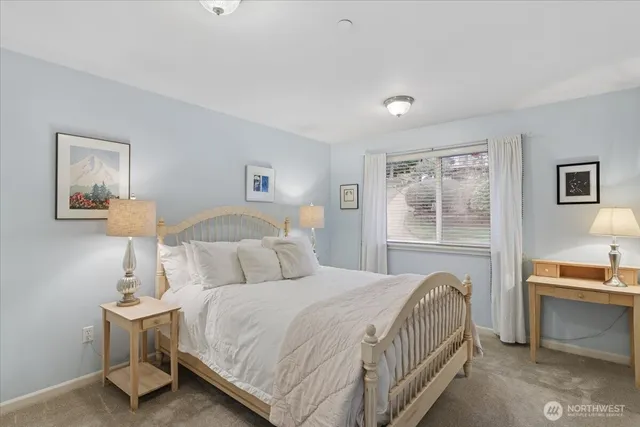 a bedroom with a bed and a cabinets