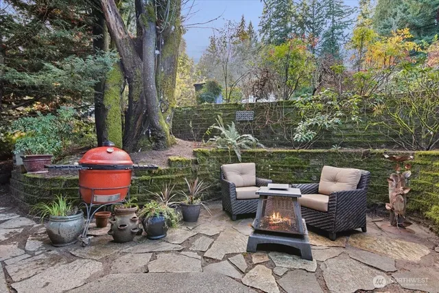 a wooden bench sitting in backside of a house