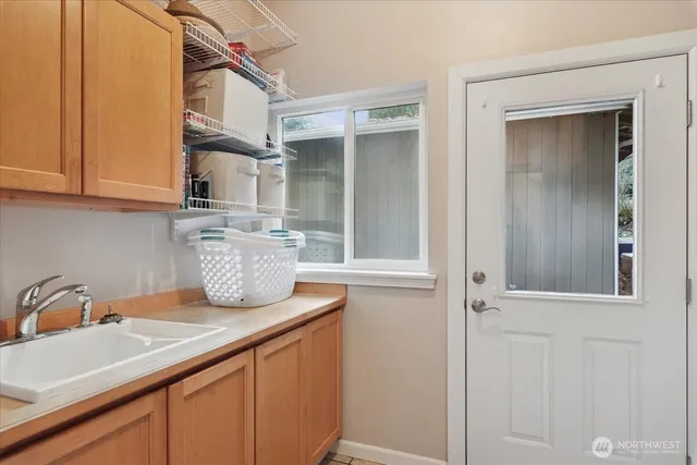 a kitchen with a sink and a refrigerator