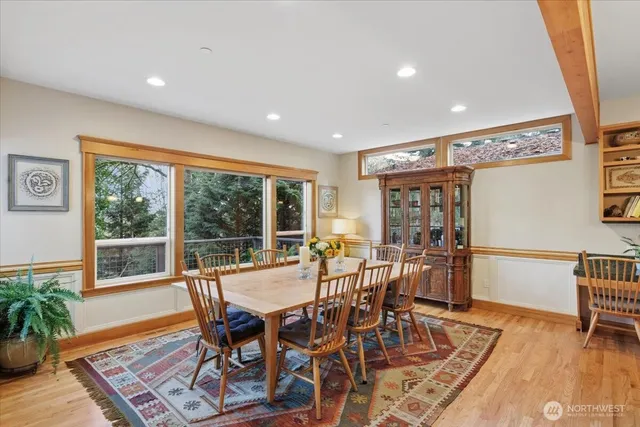a view of a dining room with furniture window and wooden floor