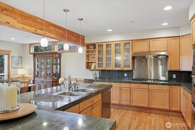 a kitchen with sink a counter and cabinets
