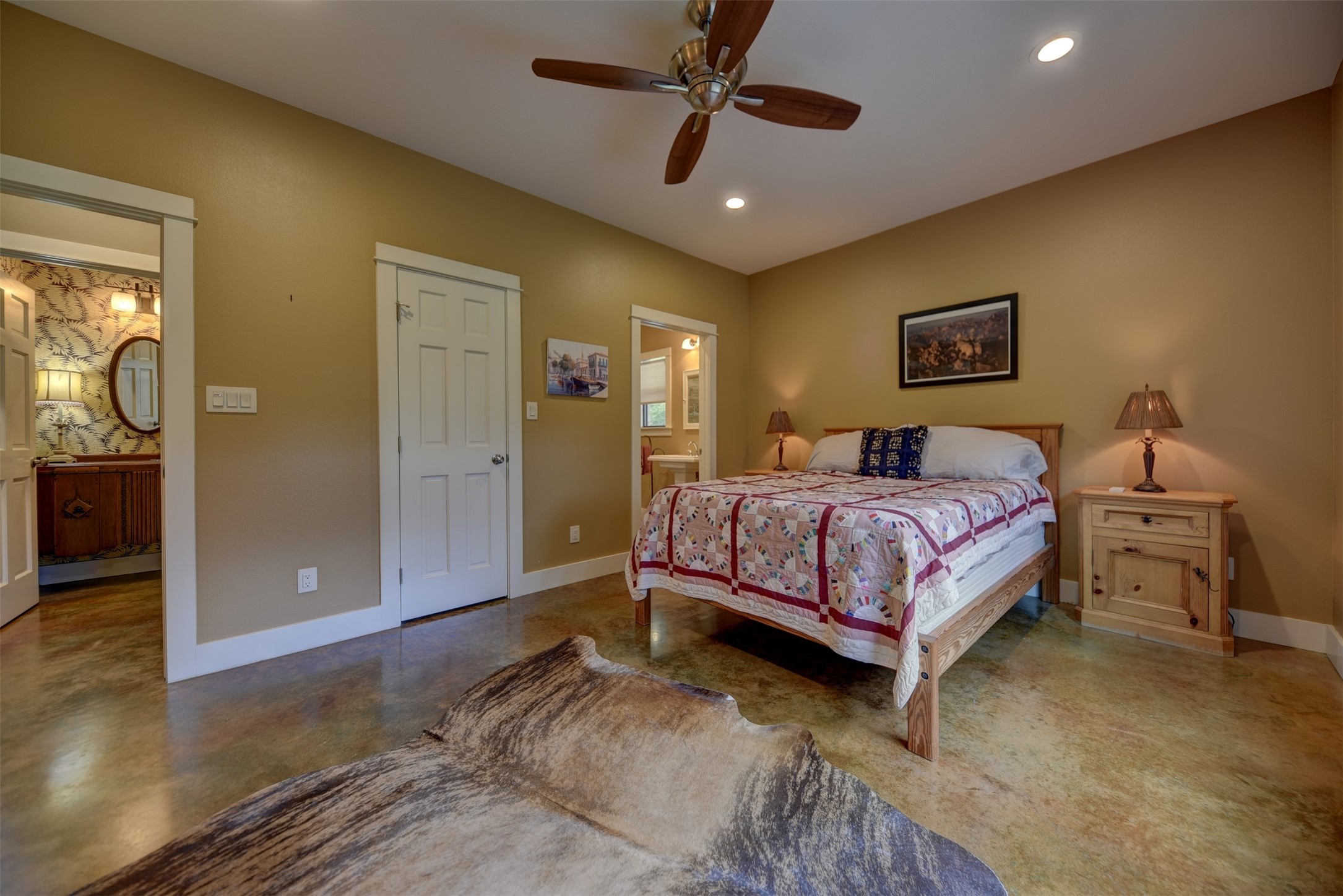 2003 Oak Ridge Road Weimar, TX 78962 - Photo 13 of 35 a bedroom with a bed and a chandelier