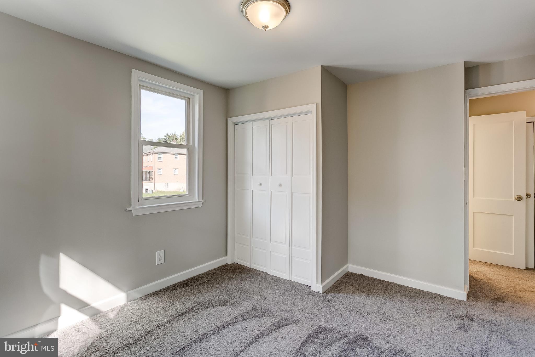 771 Charing Cross Road Baltimore, MD 21229 - Photo 22 of 44 a view of an empty room with window and closet area
