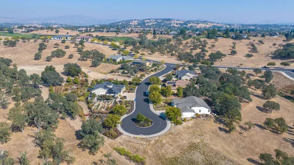 an aerial view of a house with a lake view