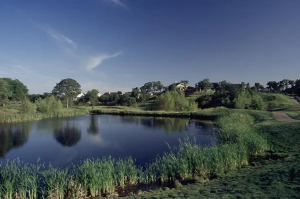 an aerial view of a house with a lake view